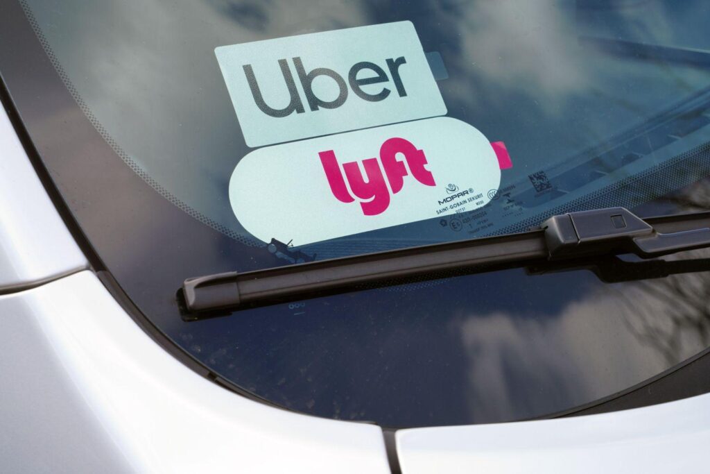 Uber and Lyft badge on a rideshare car. Lyft Accident Lawyer , Uber accident lawyer.