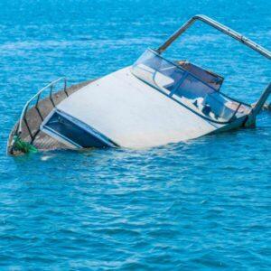 A boat sinking, with the owner wondering if they can sue after a boating accident