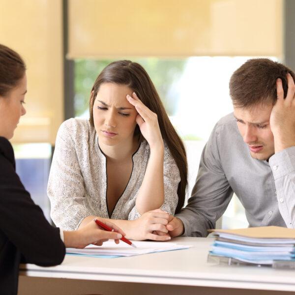 Lawyer explaining what is considered sexual abuse to a man and a woman