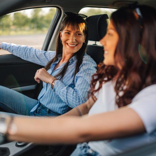 Two women driving in a car wonder what happens if someone else is driving my car and gets in an accident?