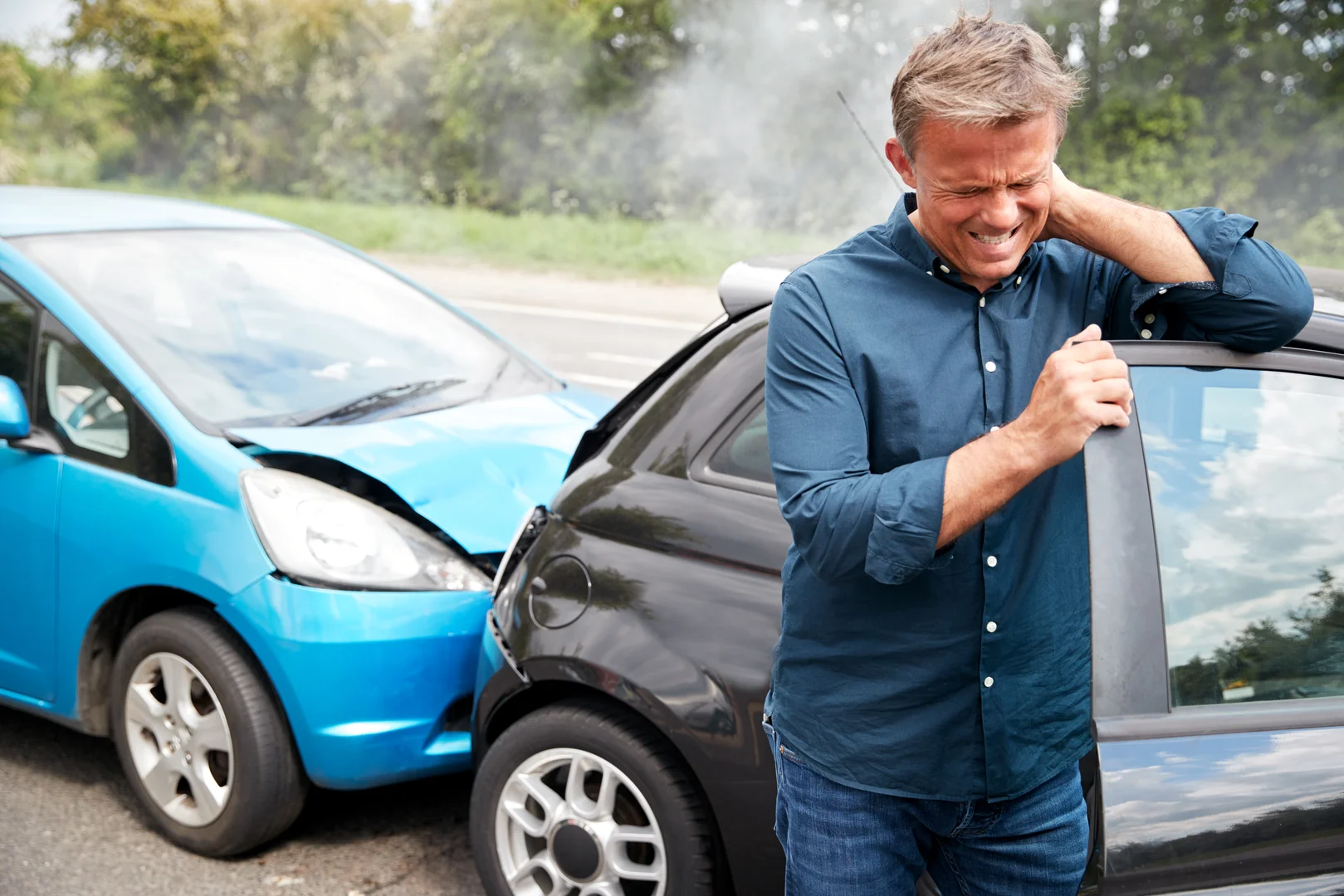Rideshare accident crash between a blue car and a black car.