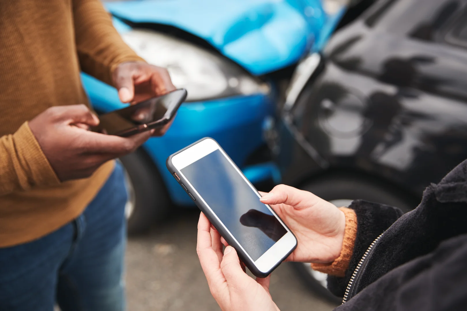Drivers swap information after an accident.